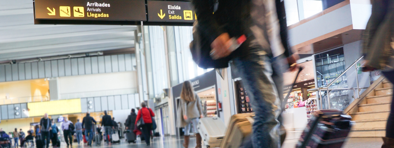 Passengers walking through an airport