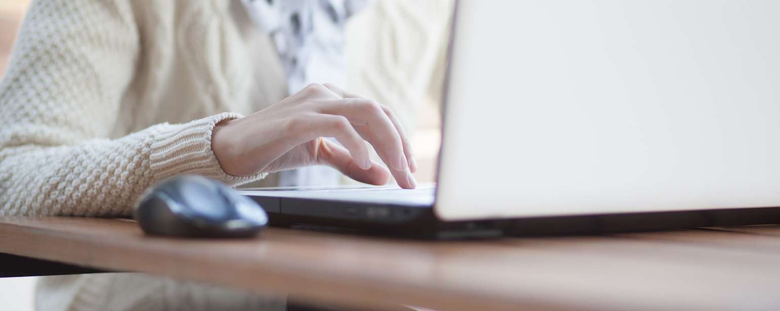 Closeup of woman hand typing on notebook outdoor fb