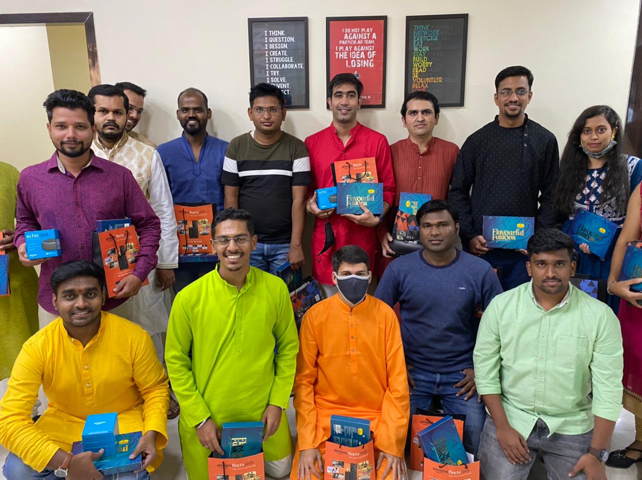 Group of 24/7 Software employees holding gifts