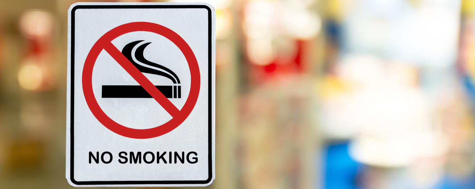 No Smoking label in the public with blur nature background