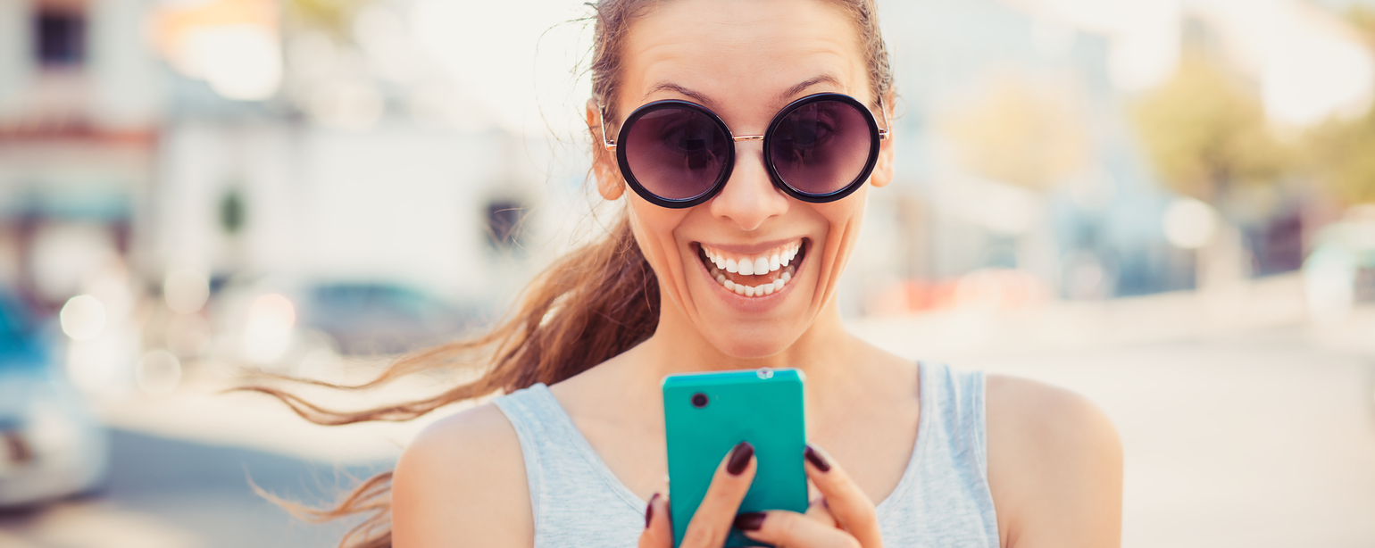 Woman texting. Closeup young happy smiling