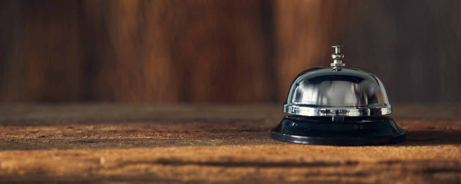 Bell on wood for service with blurred wooden background fb