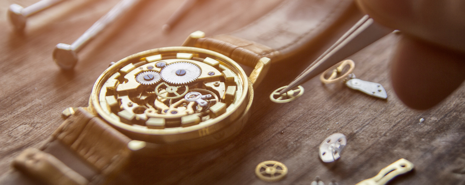 Watchmaker is repairing the mechanical watches in his workshop