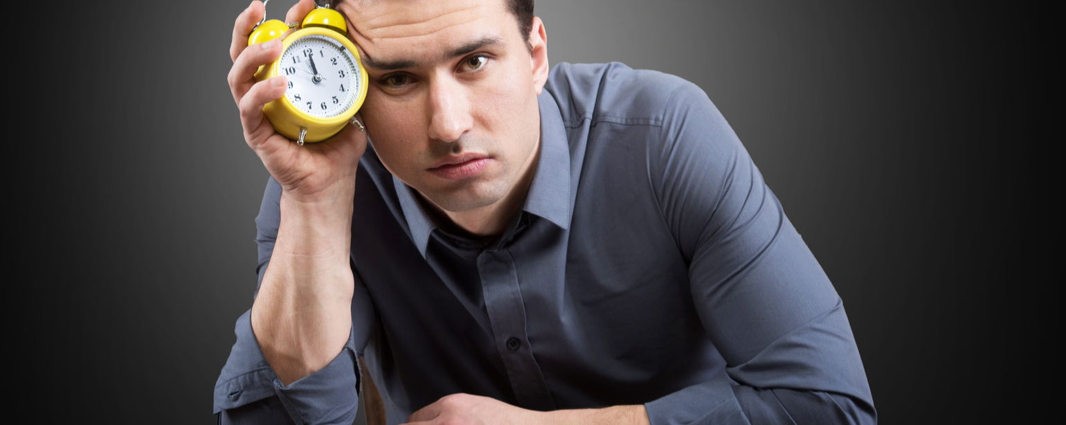 man cutting clock sitting on plate