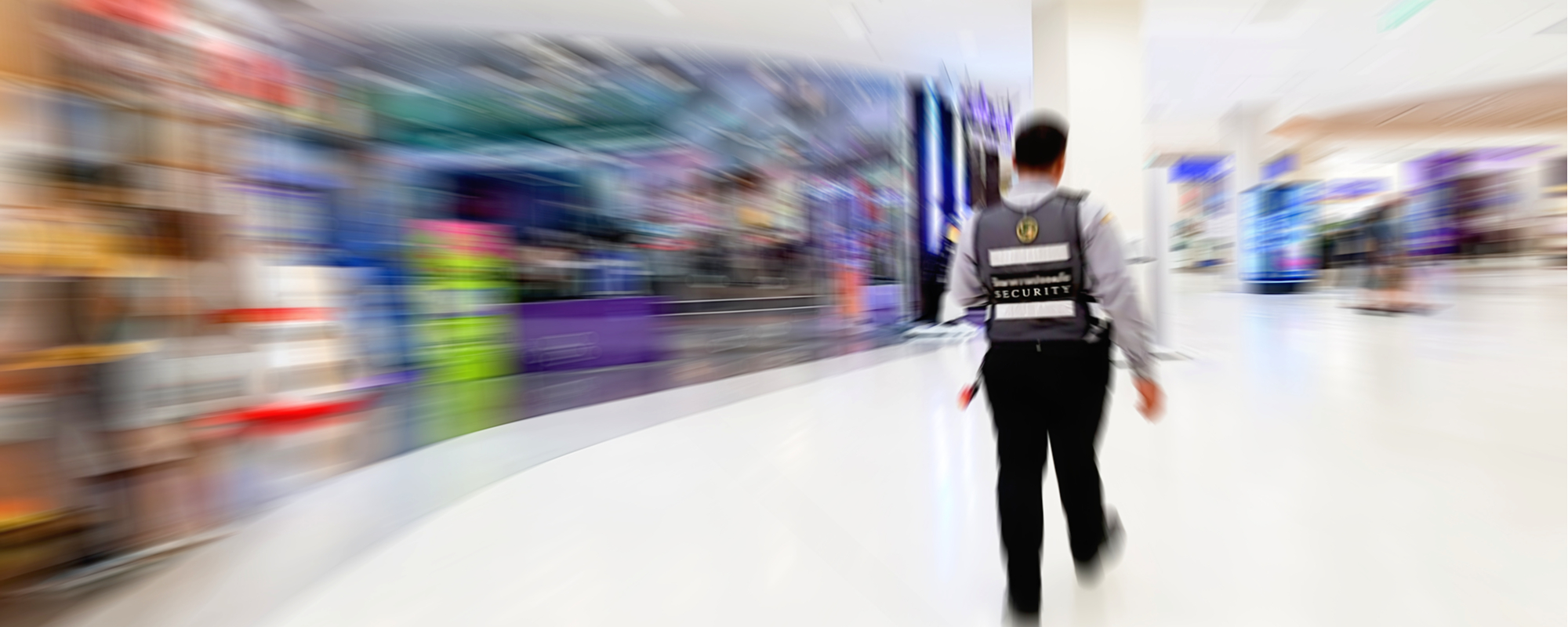 Motion blur image of the security guard in the mall