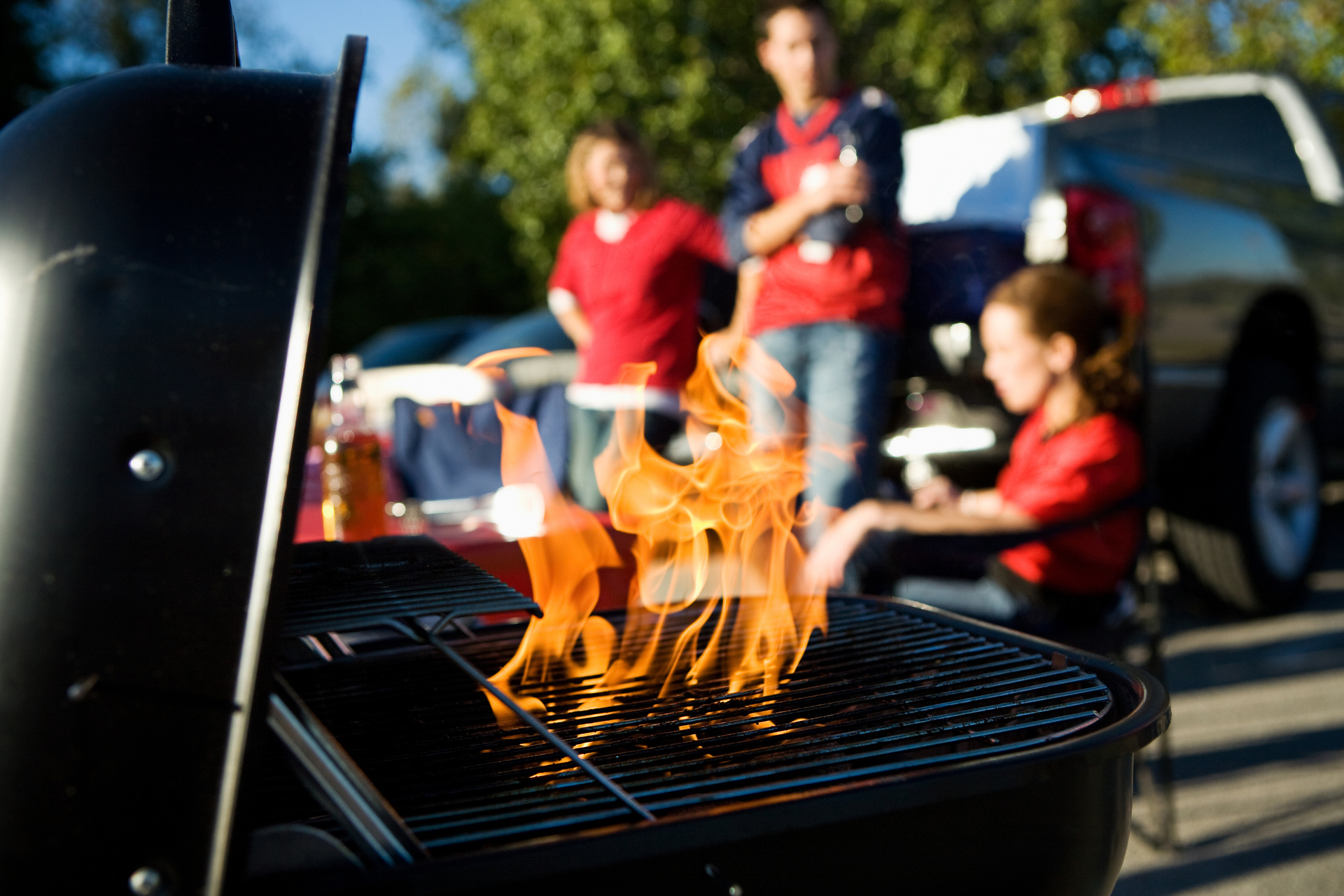 Charcoal Burning In Grill During Tailgating Party