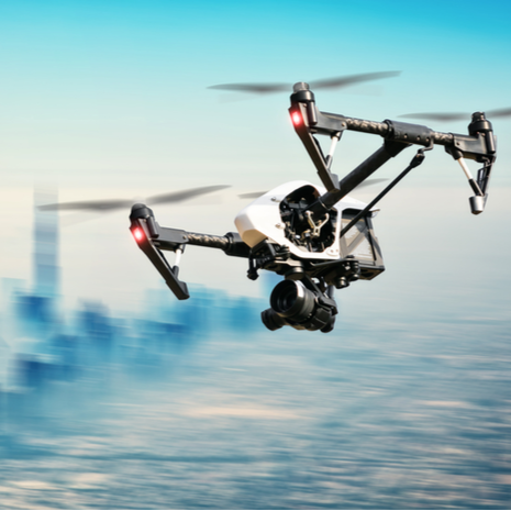 Drone flying above city panorama in blur motion
