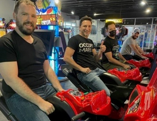 team on arcade racing machines