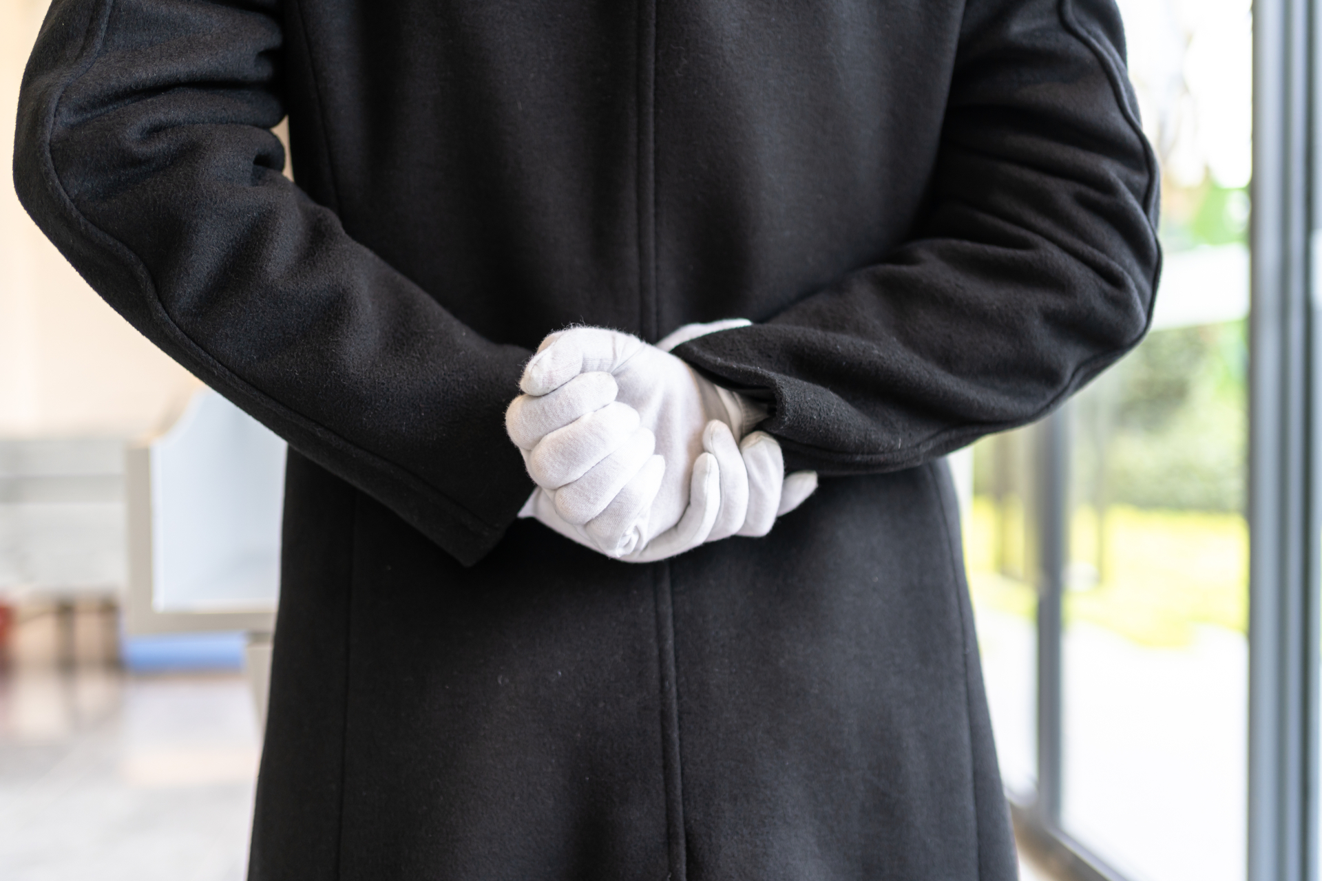 customer service person wearing white gloves